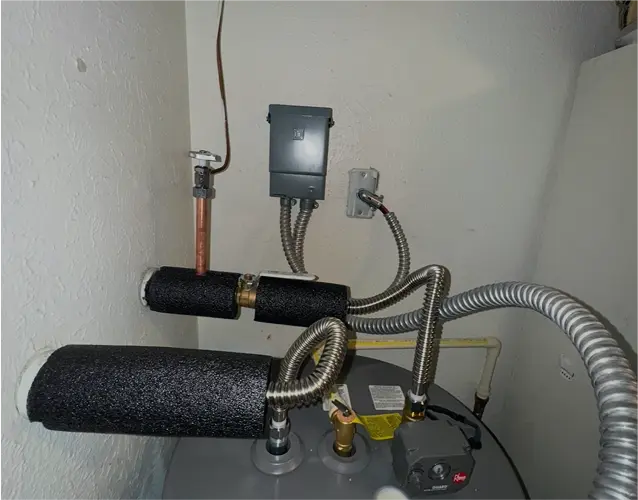 Dallas hot water heater repair expert fixing a residential unit for reliable hot water