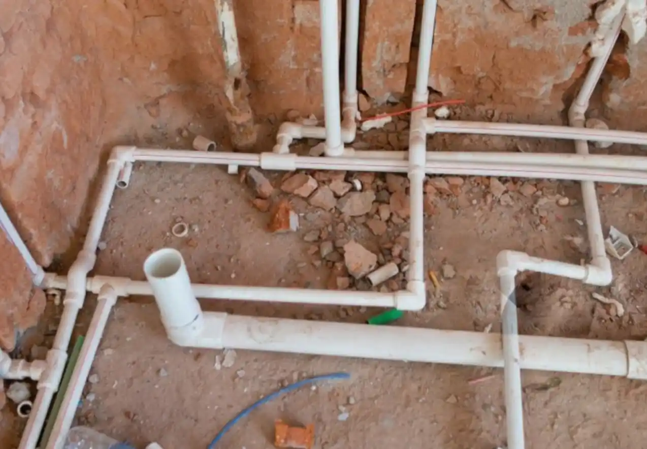 Dallas plumber repairing a broken drain pipe to restore proper water flow