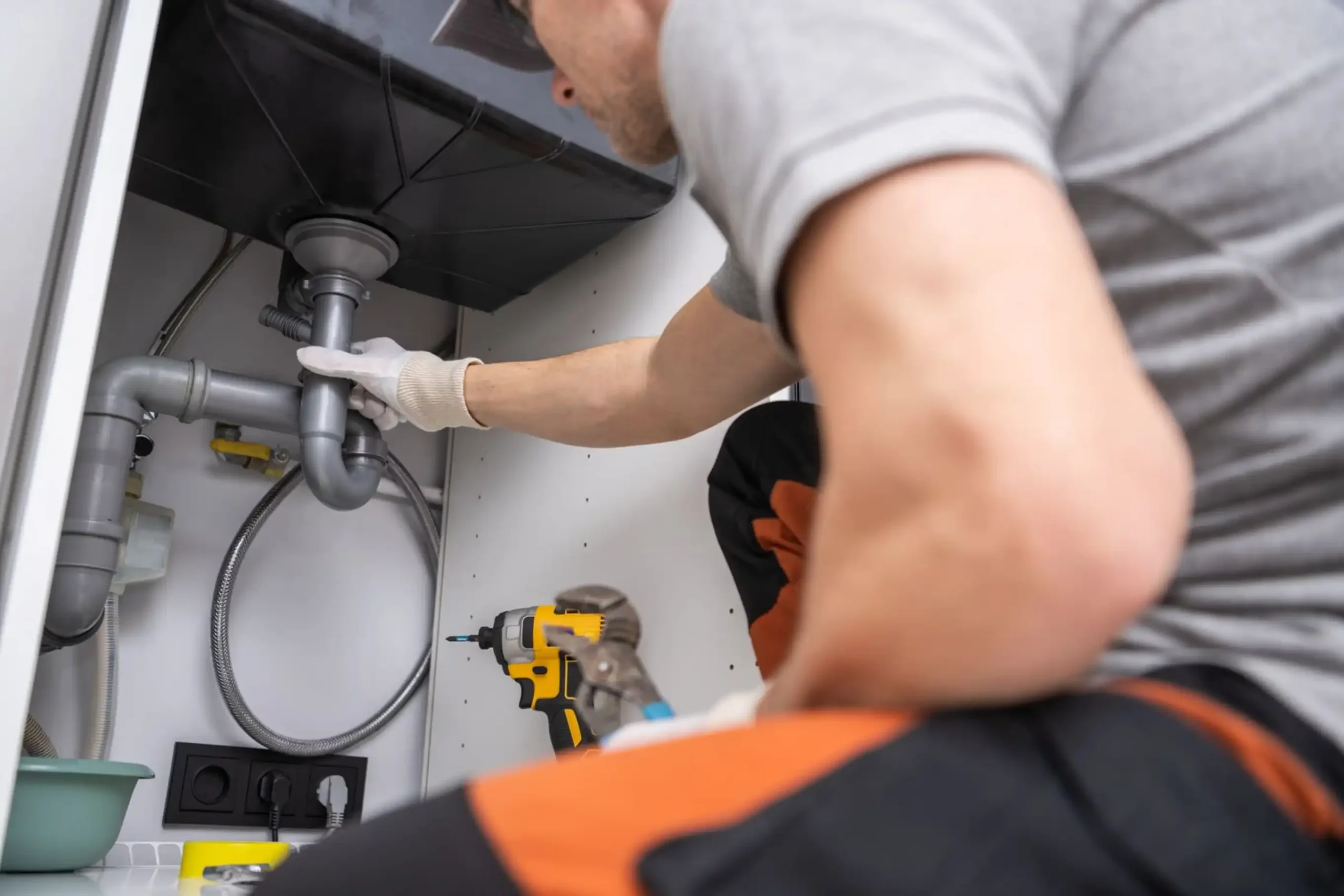 Dallas drain cleaning expert unclogging a residential sink for smooth water flow